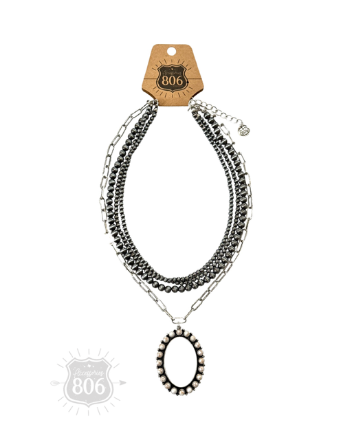 Burnished silver necklace, oval stone pendant