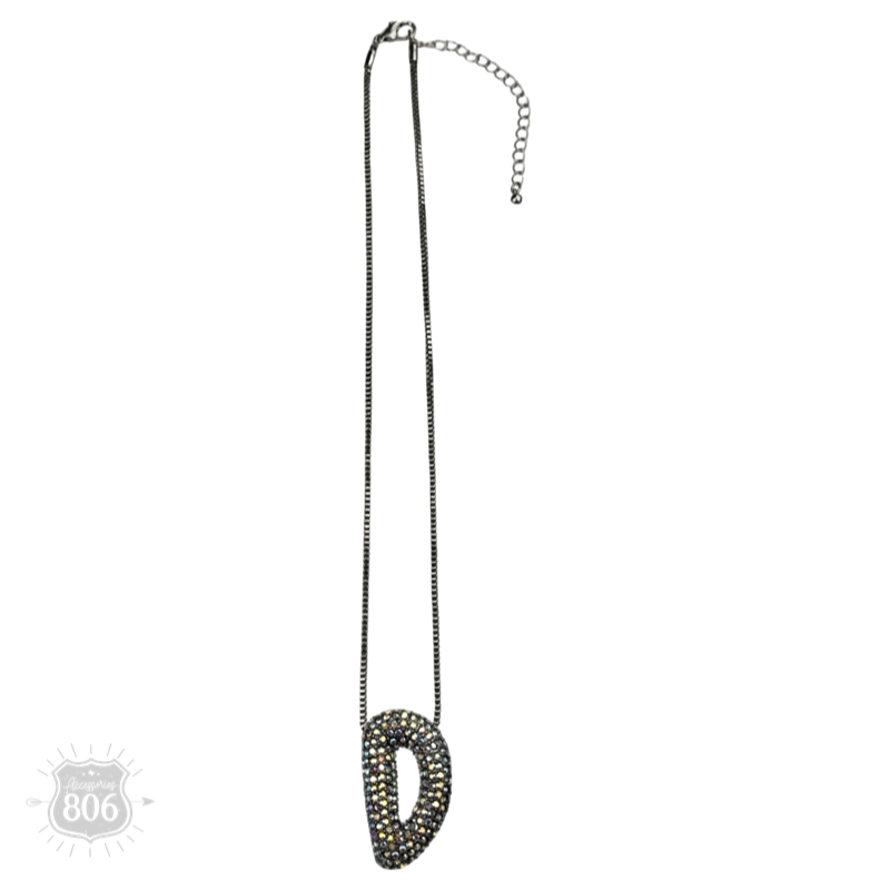 Rhinestone letter pendant on silver necklace