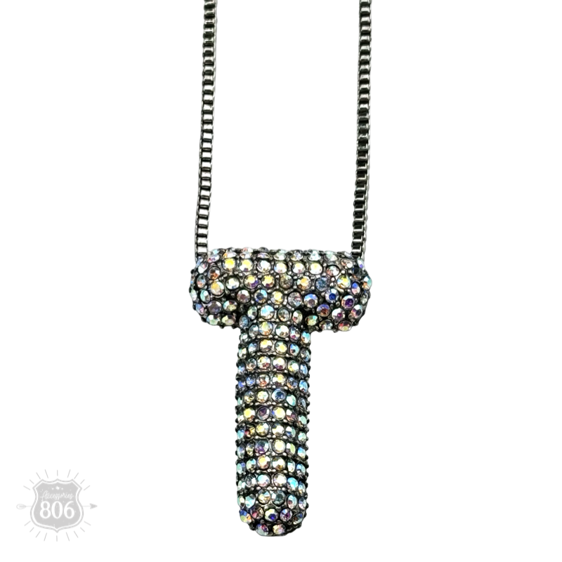 Rhinestone letter pendant on silver necklace