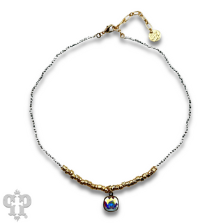 Seed and chunky gold bead necklace with Austrian crystal pendant