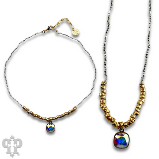 Seed and chunky gold bead necklace with Austrian crystal pendant