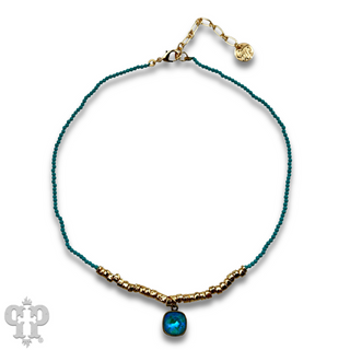 Seed and chunky gold bead necklace with Austrian crystal pendant