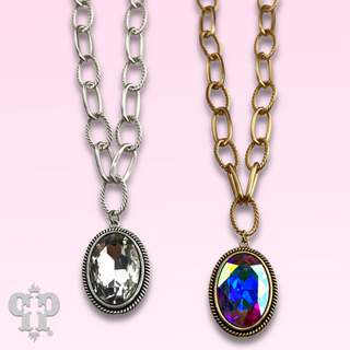 Large oval crystal pendant on chunky chain necklace