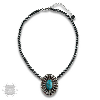 Western sunburst pendant on burnished silver bead necklace