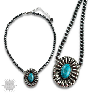 Western sunburst pendant on burnished silver bead necklace
