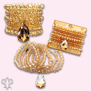 Faceted bead nine strand bracelet set, rhinestone teardrop charm