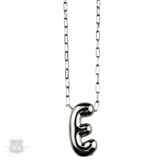 Silver letter pendant on necklace, initial monogram