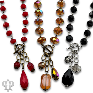 Linked faceted bead necklace with bead charms