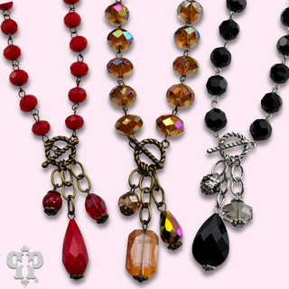Linked faceted bead necklace with bead charms