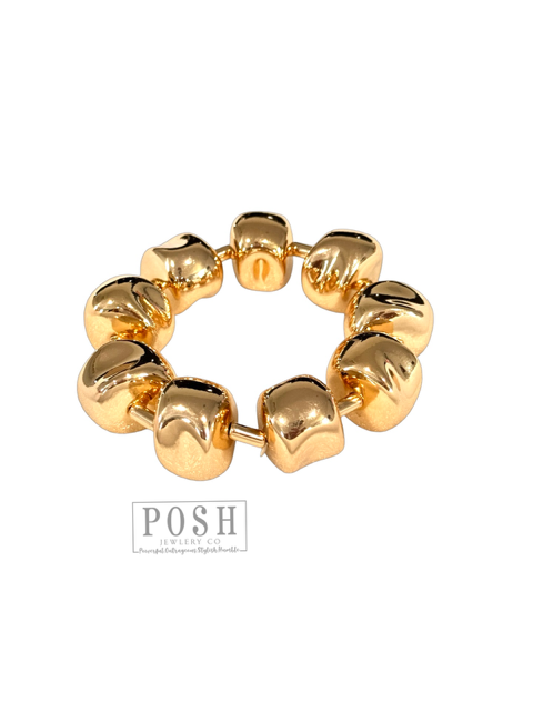 Gold tone sculptural bracelet