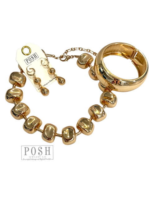 Gold tone sculptural choker
