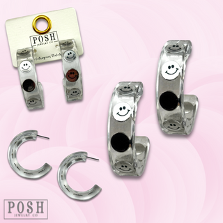 Clear hoop earring with happy faces, last call