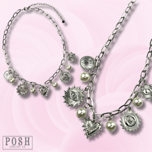 Protection charms and pearl drop necklace