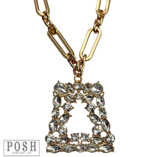 Shiny gold chain with rhinestone pendant