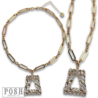 Shiny gold chain with rhinestone pendant