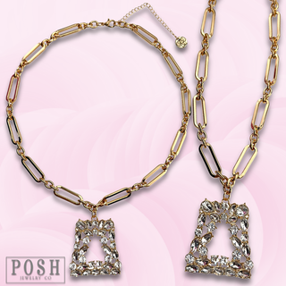 Shiny gold chain with rhinestone pendant