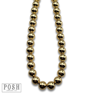 Shiny gold bead necklace
