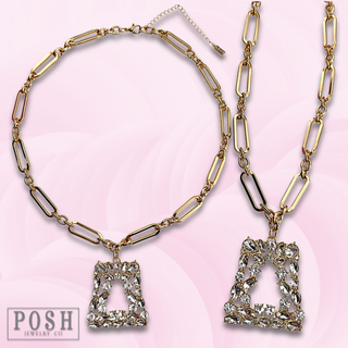 Shiny gold chain with rhinestone pendant