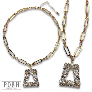 Shiny gold chain with rhinestone pendant