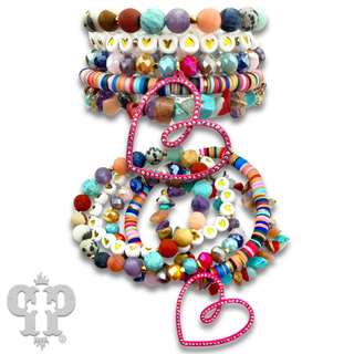Nine strand bracelet with open heart charm