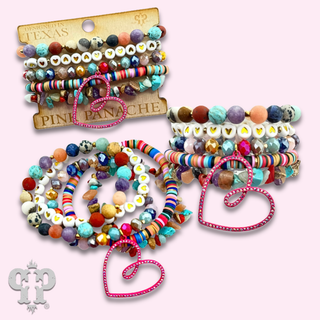 Nine strand bracelet with open heart charm