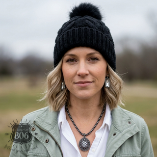 Cable knit pom-pom beanie