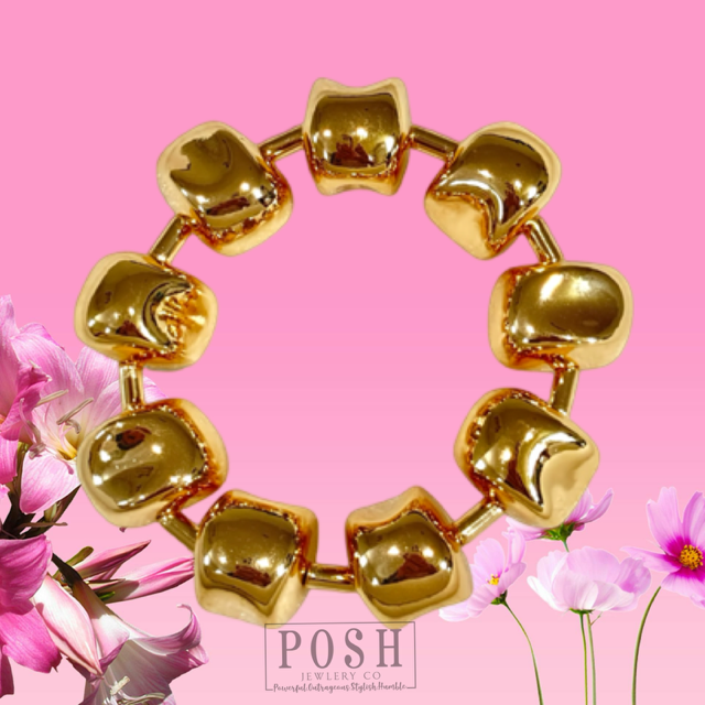 Gold tone sculptural bracelet