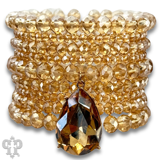 Faceted bead nine strand bracelet set, rhinestone teardrop charm