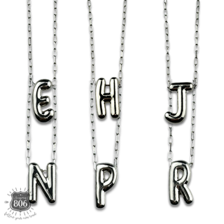 Silver letter pendant on necklace, initial monogram