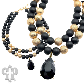 Wood and gold tone bead necklace with rhinestone teardrop charm - LC