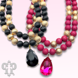 Wood and gold tone bead necklace with rhinestone teardrop charm - LC