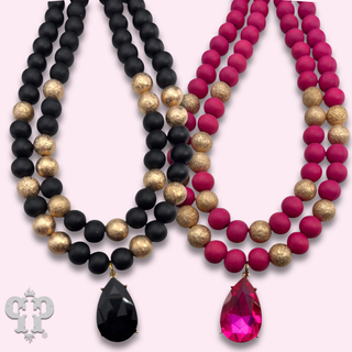 Wood and gold tone bead necklace with rhinestone teardrop charm - LC