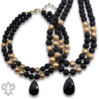 Wood and gold tone bead necklace with rhinestone teardrop charm - LC