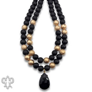 Wood and gold tone bead necklace with rhinestone teardrop charm - LC