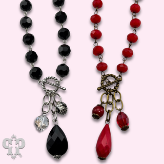 Linked faceted bead necklace with bead charms