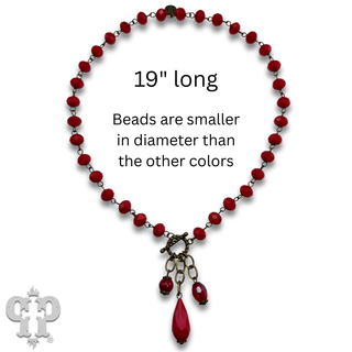 Linked faceted bead necklace with bead charms