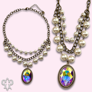 Oval rhinestone pendant with layered look pearl bead necklace