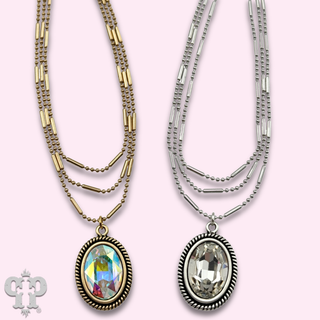 Three strand chain necklace with oval rhinestone pendant