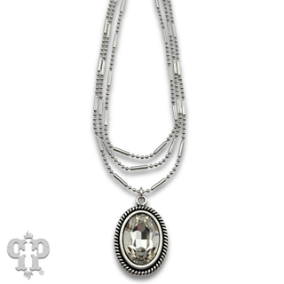 Three strand chain necklace with oval rhinestone pendant