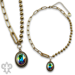 Vertical oval crystal pendant on mixed chain necklace