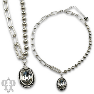 Vertical oval crystal pendant on mixed chain necklace