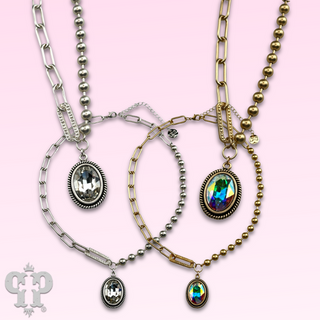 Vertical oval crystal pendant on mixed chain necklace