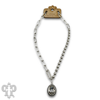 Vertical oval crystal pendant on mixed chain necklace