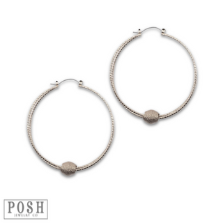 Textured circle and floating charm earring