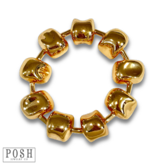 Gold tone sculptural bracelet