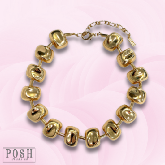 Gold tone sculptural choker