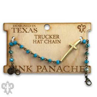 Trucker hat chain with cross charm on a wooden tag labeled 'PINK PANACHE'.